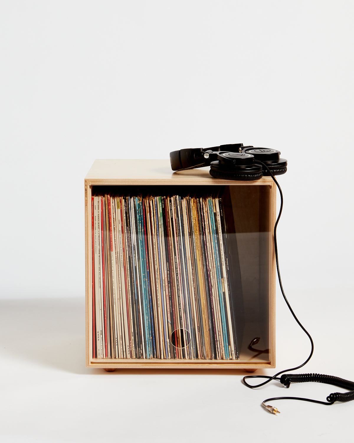 A stackable wooden storage cube for vinyl records