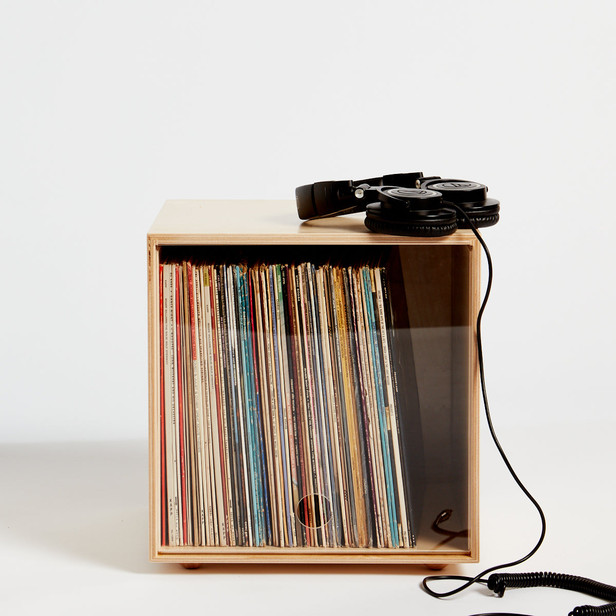 A stackable wooden storage cube for vinyl records